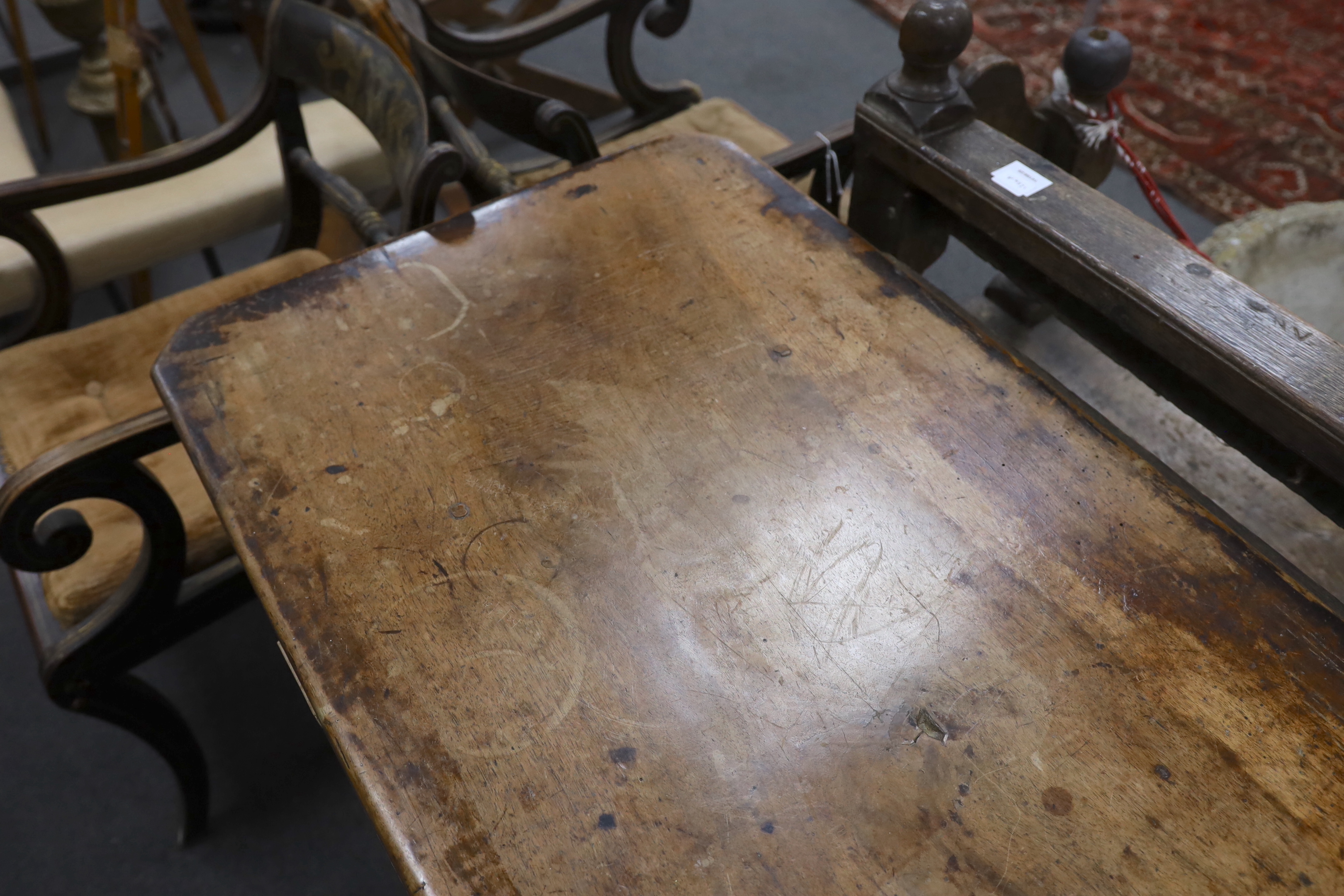 An 18th century style walnut refectory table, width 270cm, depth 59cm, height 74cm, Provenance- Brede Place, East Sussex, a former residence of the Frewen family from 1712-1936.